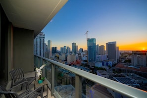 Witness spectacular sunrises or sunsets over the cityscape from your own private balcony