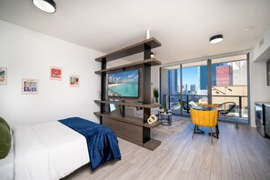 Perfect for a city stay - This stylish studio offers a comfortable sleeping area, a cozy living space, and a balcony to enjoy the urban scenery