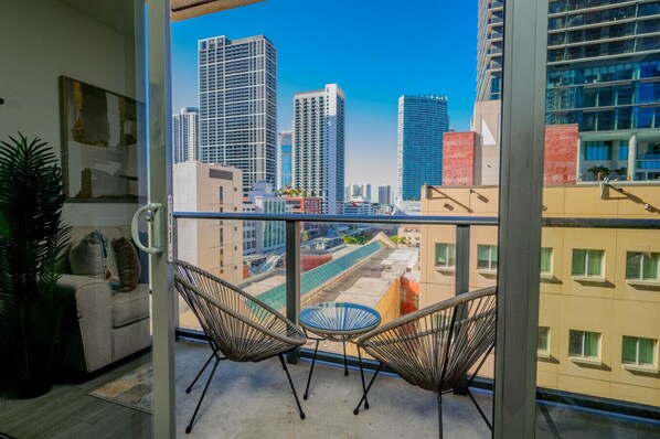 Enjoy breathtaking daytime views of the city from your stylish balcony. An urban oasis