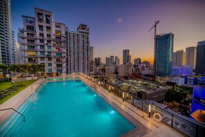 Experience peaceful evenings by our rooftop pool with a breathtaking cityscape as your backdrop