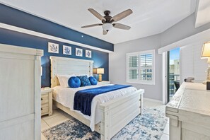 Primary bedroom with access to the balcony.