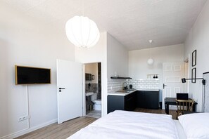 Studio with TV, dining space and private kitchen