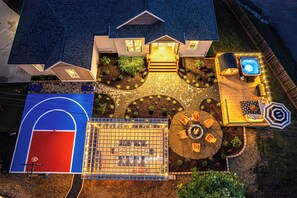 Discover a dream retreat with basketball court, pergola dining, hot tub and more