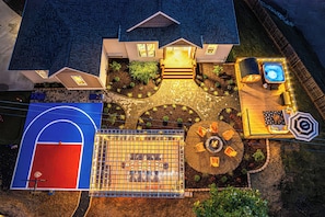 Discover a dream retreat with basketball court, pergola dining, hot tub and more