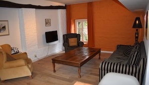 Living area. Exact unit will be assigned upon arrival. Views, colors, and decor may vary.