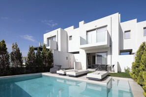 Pull up a sun lounger and relax in the pool area. 