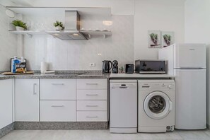 Fully Equipped Kitchen with Fridge, Dishwasher, Washing Machine, Coffee Maker & More. 