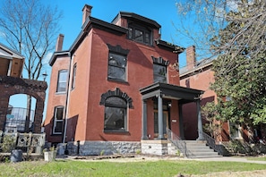 Exterior: Welcome to your Louisville getaway! This stunning red-brick home, offers a charming and elegant exterior, inviting you to experience the best of city living.