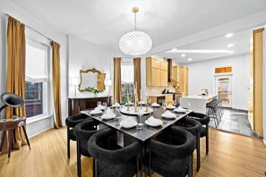 Dining Area: Host unforgettable dinners in this elegant dining room, seamlessly connected to a gourmet kitchen.
