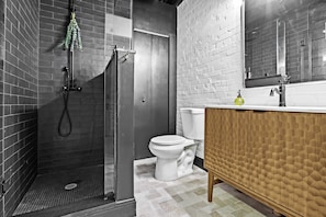 Full Bathroom : Start your day refreshed in this sleek and modern full bathroom, featuring a stylish shower.