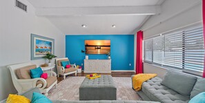 Our cozy living room features a pop of color and plenty of space to unwind.