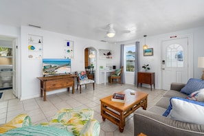 Unit A Living Room - Dedicated Workspace, Queen Sleeper Sofa + TV