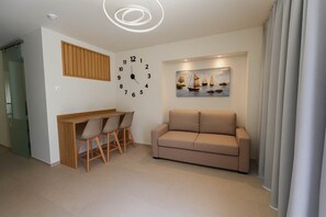 Cozy Living Area with Sofa Bed – Ideal for relaxing or accommodating additional guests.

