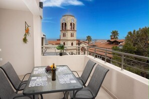 Private Balcony with Church View
Cozy outdoor seating area overlooking the charming village and historic church.