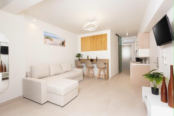Bright Open-Plan Living Area – Comfortable seating with modern decor and ambient lighting.

