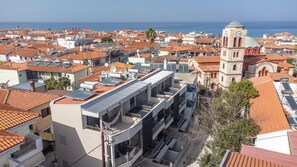 Aerial View of Pefkochori Center – Property Establishment-  Steps away from vibrant shops, cafes, and the promenade.

