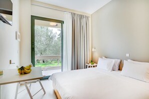 Bright and minimal bedroom with natural light and a peaceful ambiance.