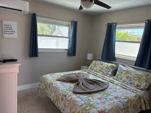 King bed with sheets.