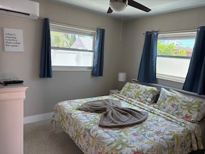 King bed with sheets.