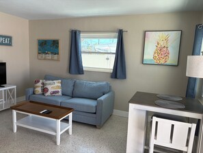Queen size pull out sofa with sheets, blankets and pillows 