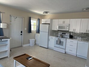Full kitchen supplied with all cooking, baking and eating needs. 