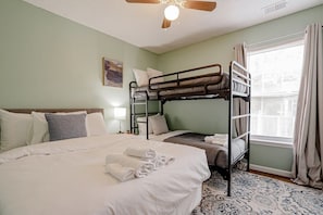 Bedroom with double bed and bunk bed.