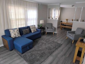 Living room with a sofa and two chairs