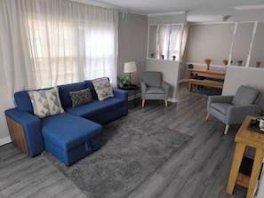 Living room with a sofa and two chairs