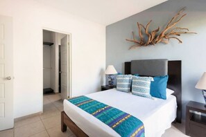 Bedroom 1 has a double bed and an ensuite full bath, AC and smart TV