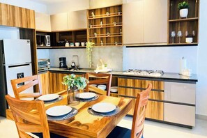 A well-equipped kitchen & dining table for meals at home