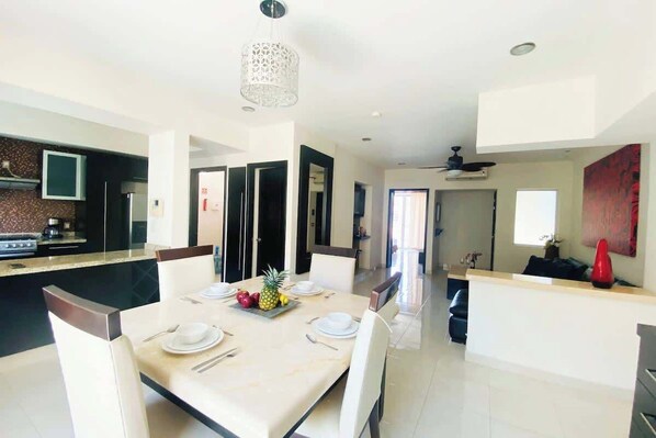 Enjoy a sit-down meal at home at this elegant dining table