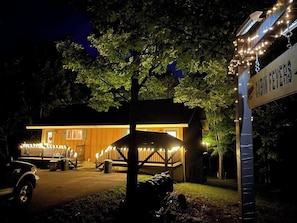 Cabin Fevers at night, cheerfully lit up.