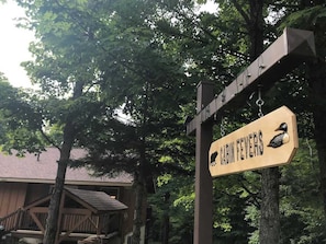 The Cabin Fevers sign is located along the road.