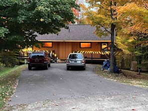 The driveway is shared with both units of Cabin Fevers. It could accommodate up to four vehicles, depending on size.