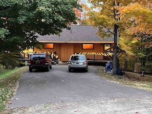 The driveway is shared with both units of Cabin Fevers. It could accommodate up to four vehicles, depending on size.
