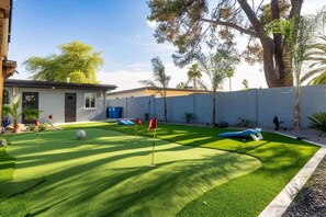 Practice your swing or enjoy a friendly competition on the private putting green.