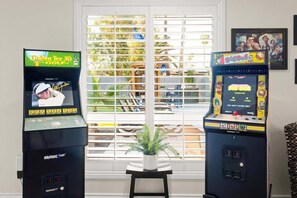 The game area is ready for some friendly competition with arcade games.