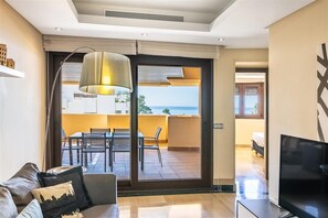 Bright lounge area with direct sea views