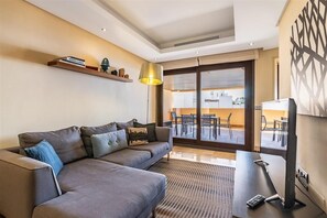 Modern lounge area with air conditioning and terrace access