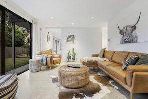 Main lounge with doors to the private garden