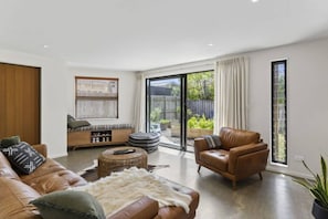 Open plan living with doors to the private garden