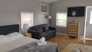 This cozy cottage has fine touches with a queen bed as well as a queen size pull out couch, dresser and smart TV.