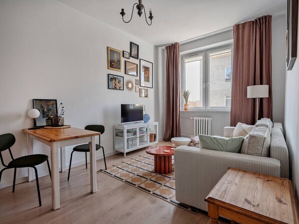 Living Room with Sofa Bed, Smart TV and Dining Table | Book Now with RENTUJEMY.COM