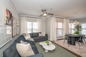 Living Room Space w/ Smart TV & Pull Out Queen Sofa Bed