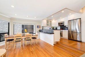 Gather around the large family-style table after whipping up meals in the fully stocked kitchen.