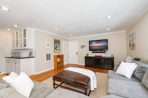 Kick back on the cozy sectional and catch your favorite show on the smart TV after a sun-soaked day.