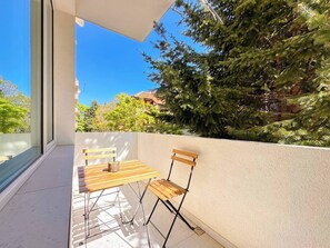 Sip coffee or wine on your private balcony with leafy views. Wondering about local spots to explore? Message us anytime!