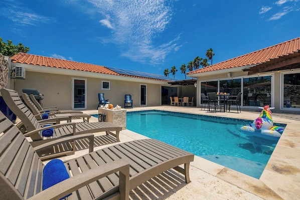 Soak up the sun by the sparkling private pool, complete with comfy loungers and a serene atmosphere—your perfect Aruba retreat.