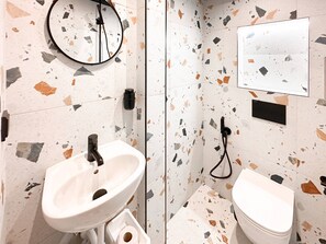 Get ready in style with a sleek vanity and walk-in shower. Curious about included toiletries? We’ve got you covered!
