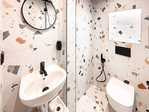 Get ready in style with a sleek vanity and walk-in shower. Curious about included toiletries? We’ve got you covered!